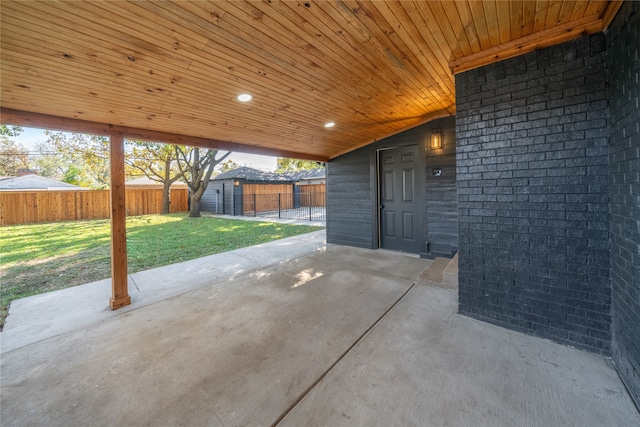 view of patio featuring a storage shed