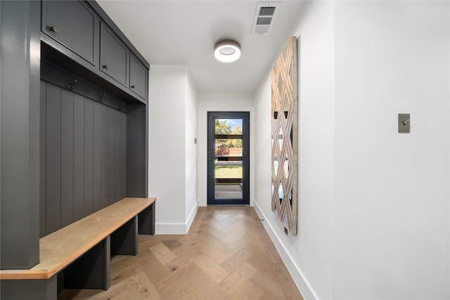 mudroom with light parquet flooring