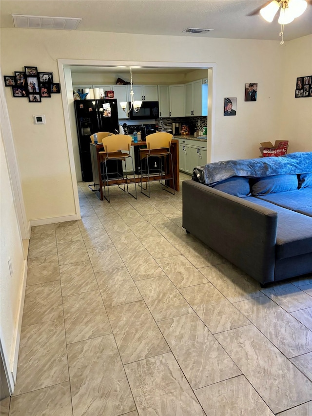 living room featuring ceiling fan