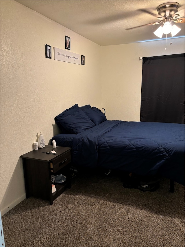 bedroom with ceiling fan and carpet floors