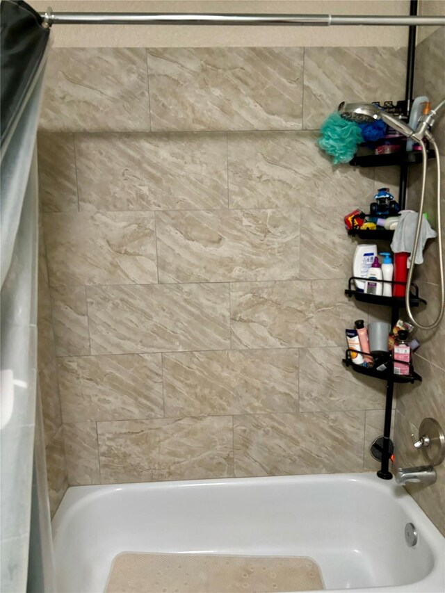 bathroom featuring shower / bath combination with curtain