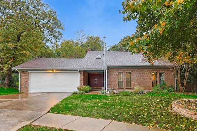 ranch-style house with a garage and a front yard