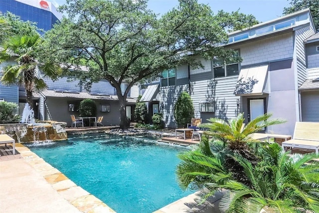 view of pool featuring pool water feature