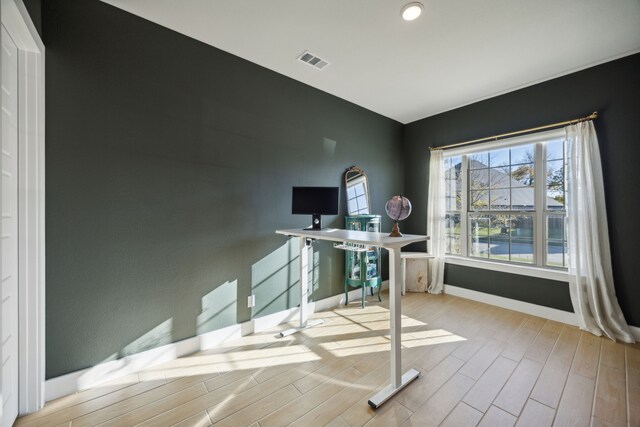 home office with light wood-type flooring