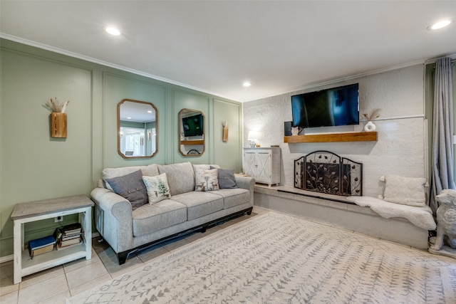 living room with tile patterned flooring and ornamental molding