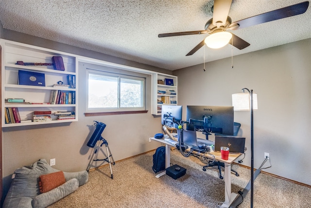 office space featuring a textured ceiling, carpet floors, and ceiling fan