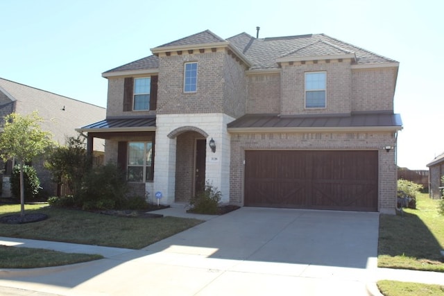 view of front facade featuring a garage and a front lawn