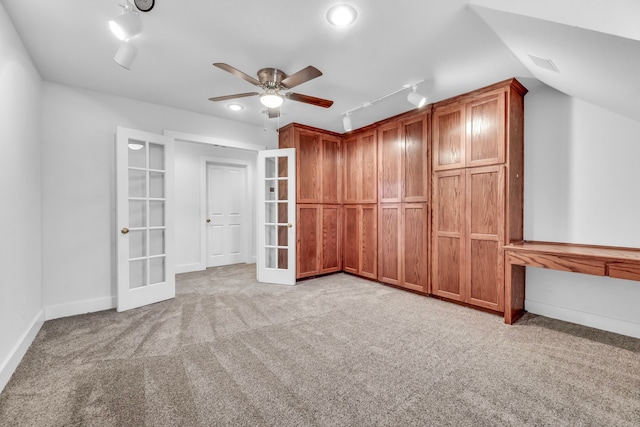 7170 Fm 1830, Argyle, TX 76226 - unfurnished bedroom with french doors, track lighting, carpet floors, and lofted ceiling