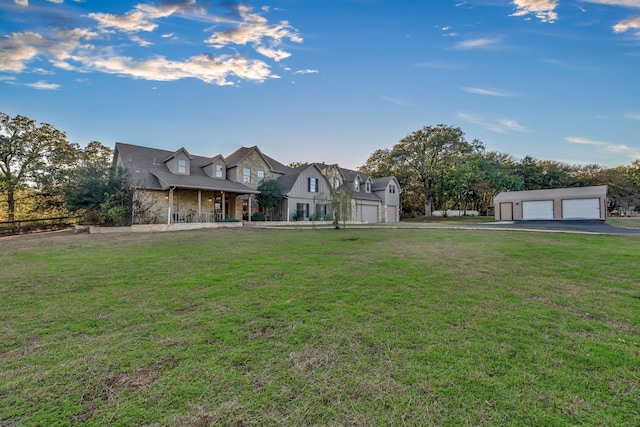 view of front facade featuring a garage and a front lawn