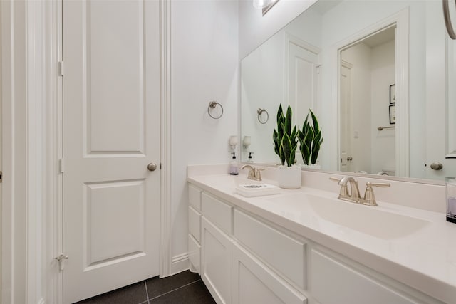 bathroom with tile patterned flooring and vanity