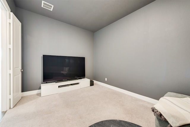 carpeted living room with lofted ceiling