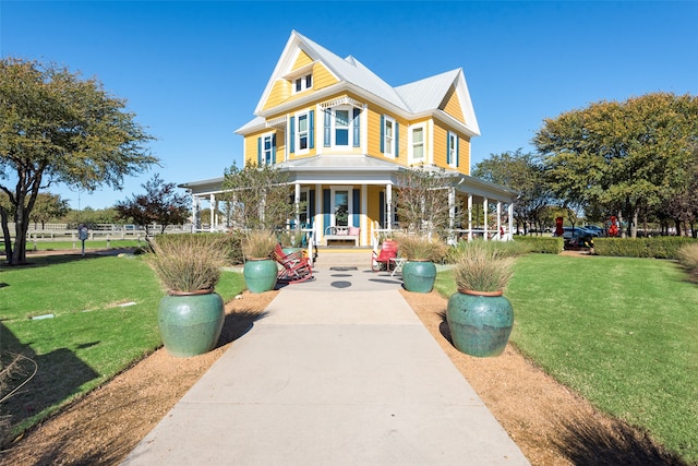 view of front of home with a front lawn and a porch