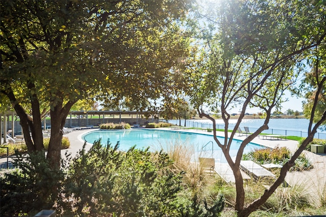 view of pool with a water view