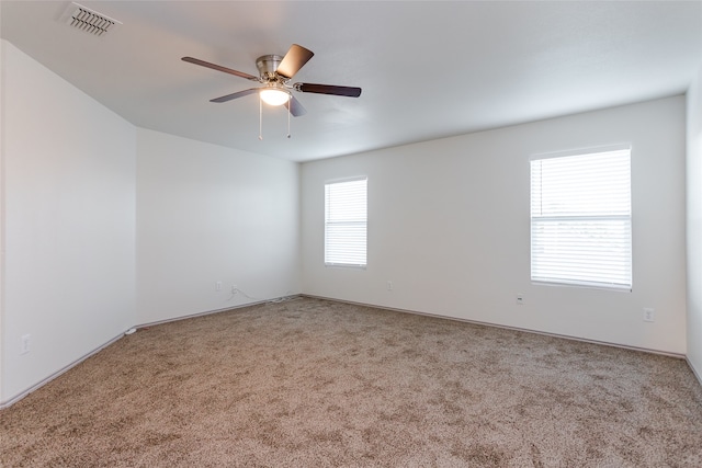 empty room with carpet and ceiling fan