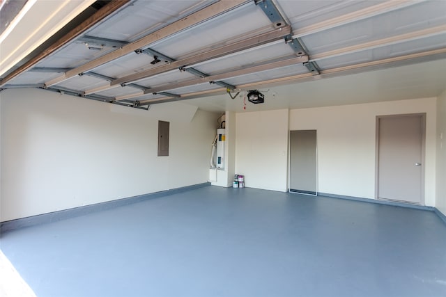 garage with secured water heater, electric panel, and a garage door opener