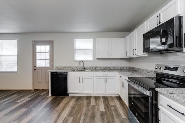 kitchen featuring white cabinets, sink, dark wood-type flooring, and black appliances