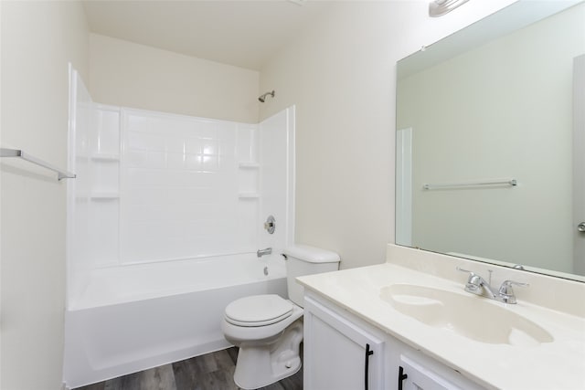 full bathroom featuring hardwood / wood-style floors, vanity,  shower combination, and toilet