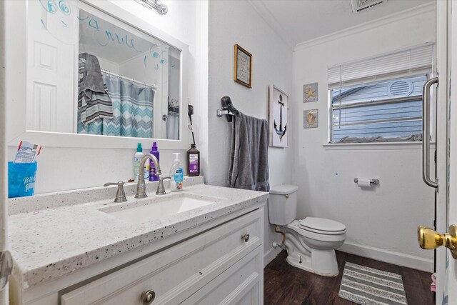 310 Collinsville St, Whitesboro, TX 76273 - bathroom with a shower with curtain, vanity, crown molding, hardwood / wood-style flooring, and toilet