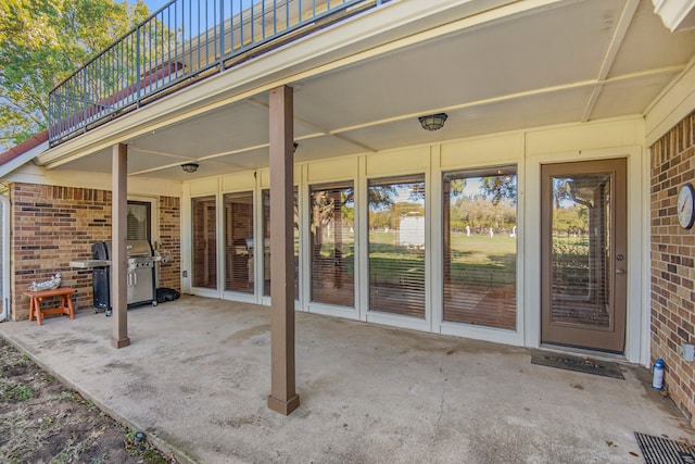 view of patio / terrace featuring area for grilling and a balcony