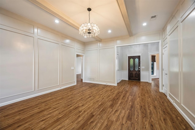 interior space with beamed ceiling, dark hardwood / wood-style floors, and a notable chandelier