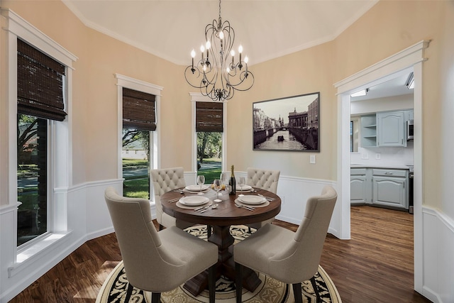 dining space featuring crown molding, a notable chandelier, and dark hardwood / wood-style flooring