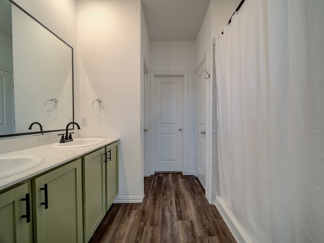 bathroom featuring vanity and wood-type flooring