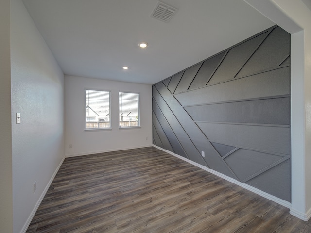 unfurnished room featuring dark hardwood / wood-style floors