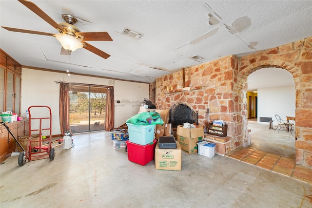 interior space with concrete flooring, a textured ceiling, and ceiling fan