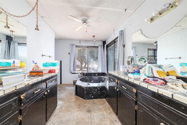 kitchen with ceiling fan and a textured ceiling