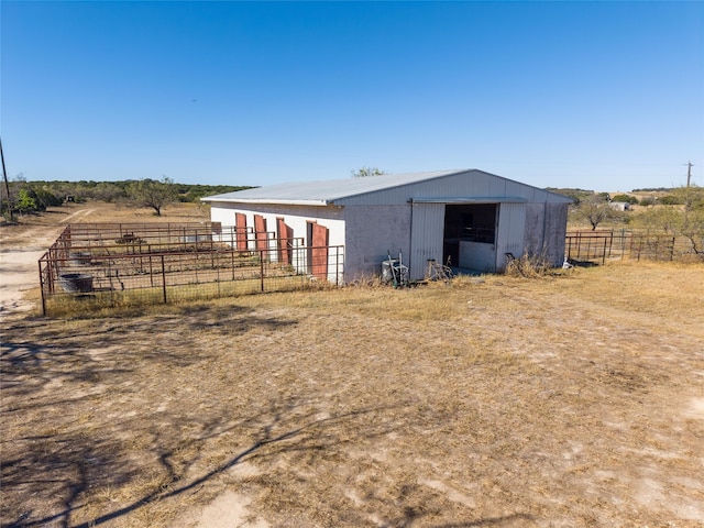 view of outbuilding featuring a rural view