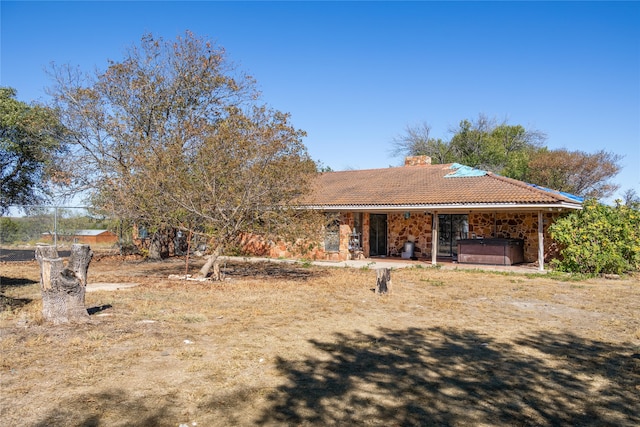 view of front of property with a hot tub