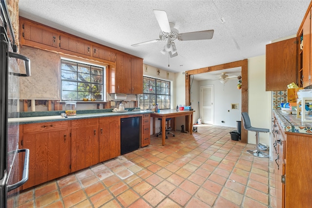 kitchen with dishwasher, a textured ceiling, ceiling fan, and light tile patterned flooring