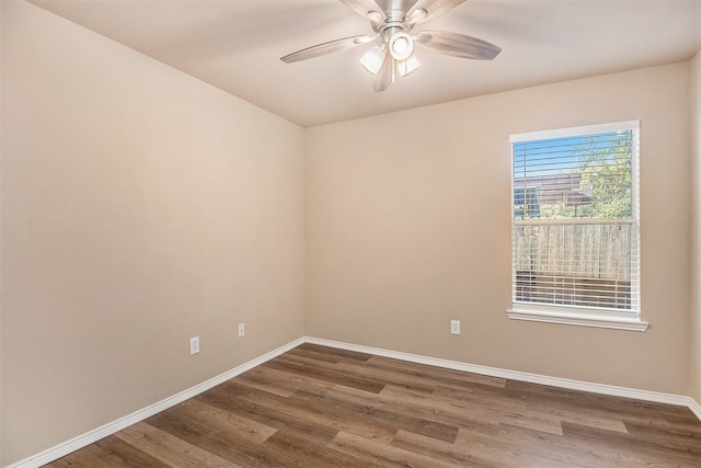 empty room featuring ceiling fan and hardwood / wood-style floors