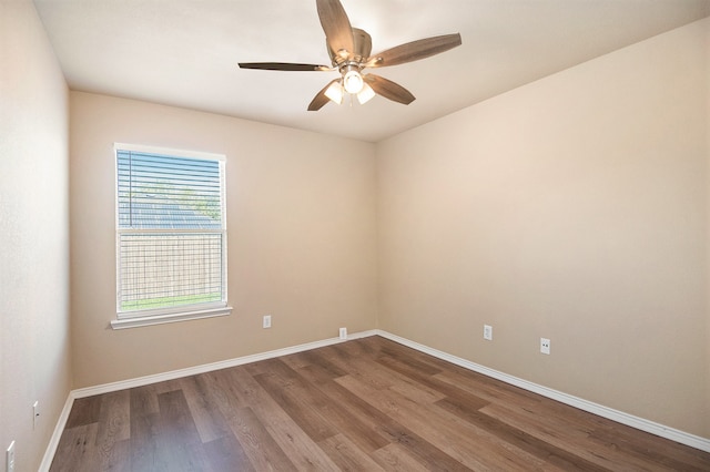 empty room featuring hardwood / wood-style floors and ceiling fan