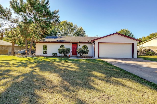 ranch-style house with a garage and a front lawn