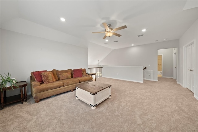 living room with ceiling fan and light colored carpet