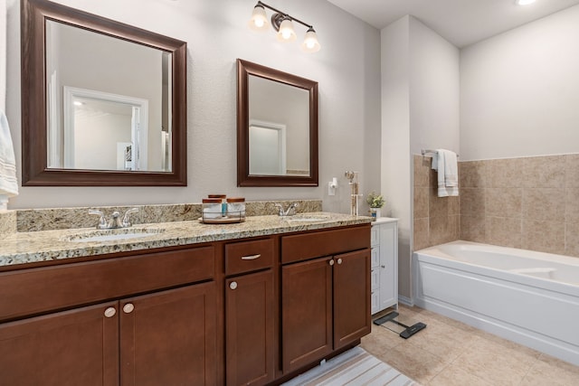 bathroom with tile patterned flooring, vanity, and a tub to relax in