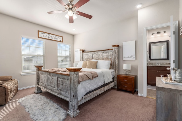 carpeted bedroom featuring connected bathroom and ceiling fan