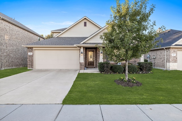 view of front of property with a garage and a front lawn