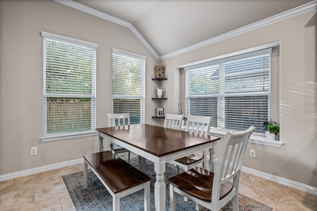 dining area featuring ornamental molding, a wealth of natural light, and lofted ceiling