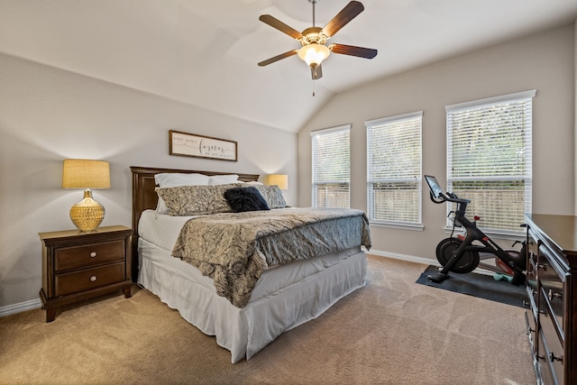 carpeted bedroom with ceiling fan and lofted ceiling