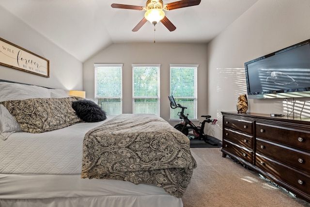 carpeted bedroom featuring ceiling fan and lofted ceiling