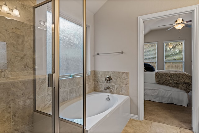 bathroom featuring ceiling fan, tile patterned flooring, plus walk in shower, and vaulted ceiling