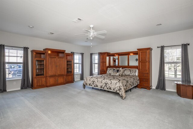 carpeted bedroom with ceiling fan