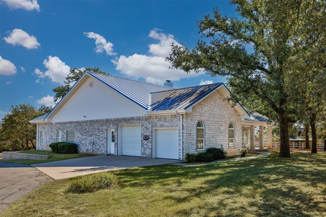 view of property exterior with a lawn and a garage