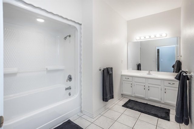 bathroom with tile patterned floors, vanity, and washtub / shower combination