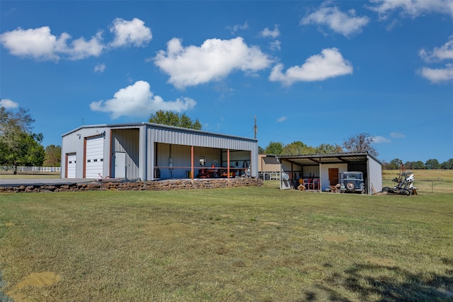 view of outbuilding with a garage and a lawn