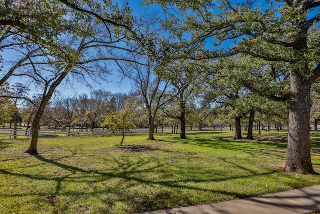 view of property's community with a lawn