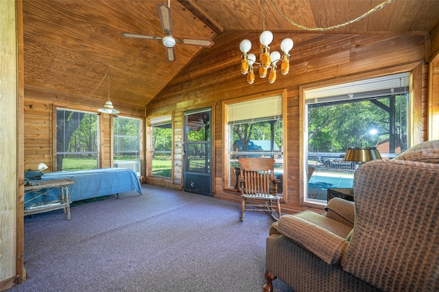 bedroom featuring carpet floors, an inviting chandelier, wood ceiling, and wood walls