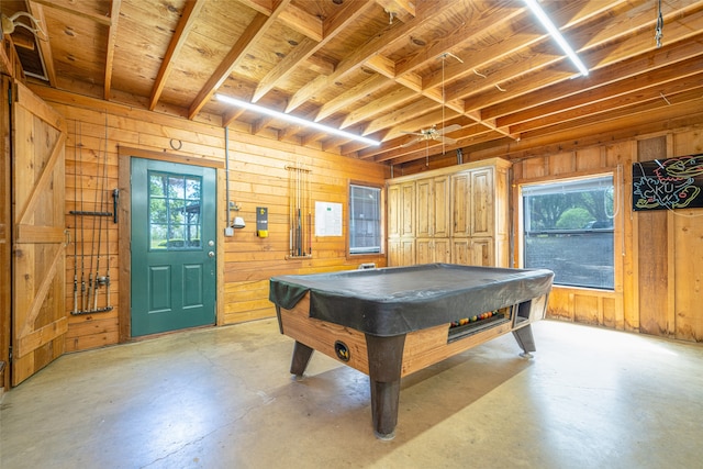 playroom with wood walls, a healthy amount of sunlight, and billiards